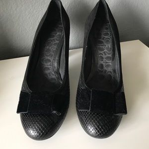 Black snakeskin and suede pumps